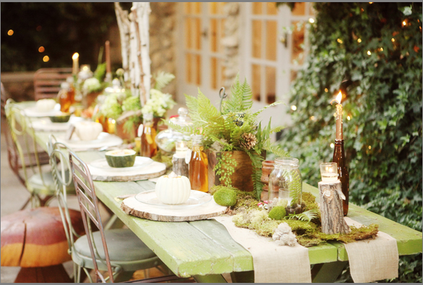 Gorgeous rustic tablescape featuring burlap runners and stump chargers