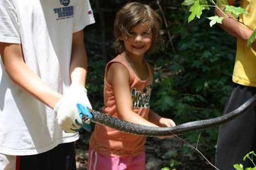 country girl petting snake