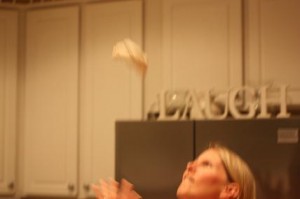 trying to toss pizza